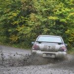 Subaru rally racing car drifting dirt road school